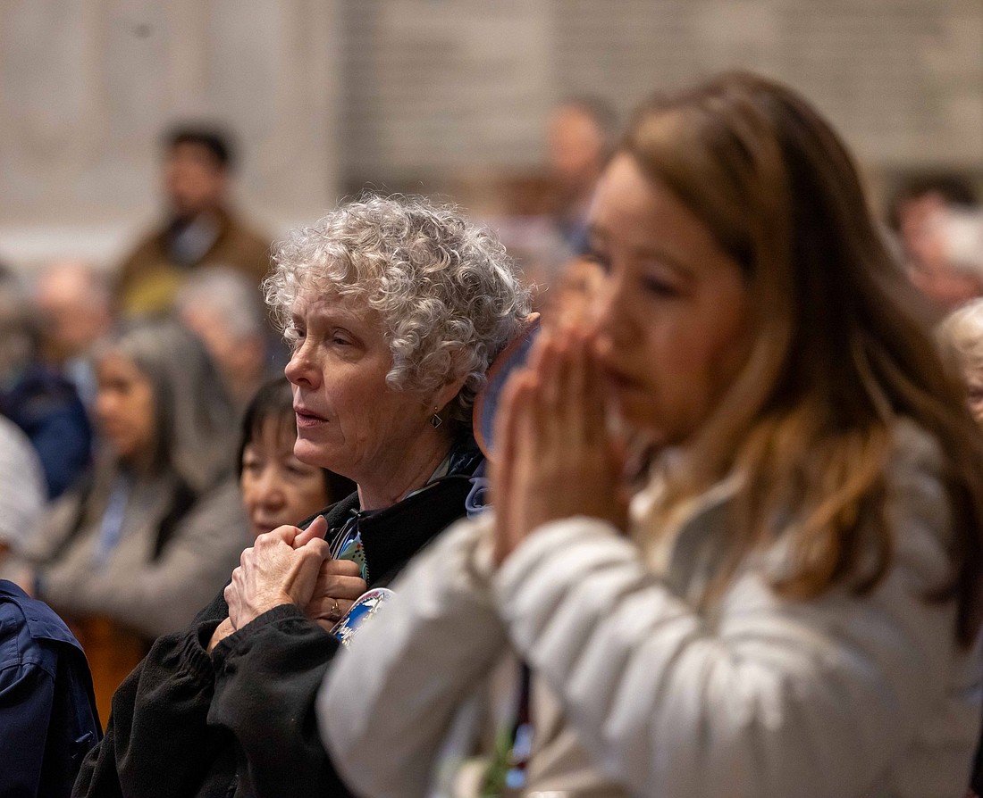 Women pray during a Mass with Holy Year pilgrims from the Diocese of Pittsburgh, the Diocese of San Bernardino, Calif., and St. Agnes School in St. Paul, Minn., at the Altar of the Chair in St. Peter's Basilica at the Vatican March 17, 2025. (CNS photo/Pablo Esparza)