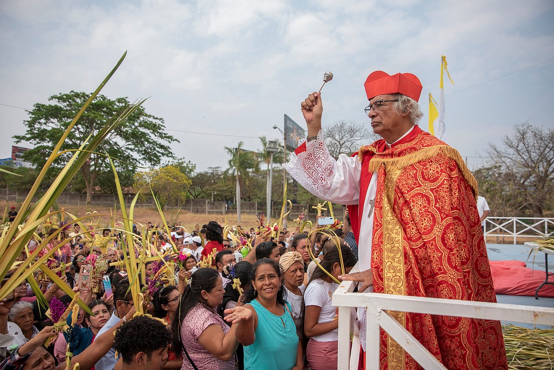 Nicaraguan Cardinal Leopoldo Brenes of Managua blesses people raising their palm fronds during Palm Sunday Mass March 24, 2024, in Managua. (OSV News photo/Maynor Valenzuela, Reuters)