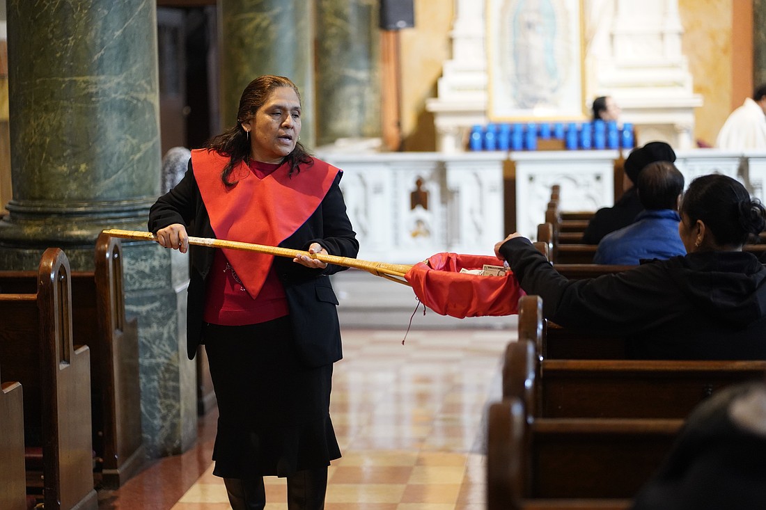 An usher takes up a collection during Mass at St. Rose of Lima Church in the Kensington section of Brooklyn, N.Y., April 7, 2025. The U.S. Conference of Catholic Bishops reports on its recent trip to Ukraine, led by Bishop Jerry L. Vincke of Salina, Kan., which surveyed the impact of the annual collection for the Catholic Church in Eastern Europe. (OSV News photo/Gregory A. Shemitz)