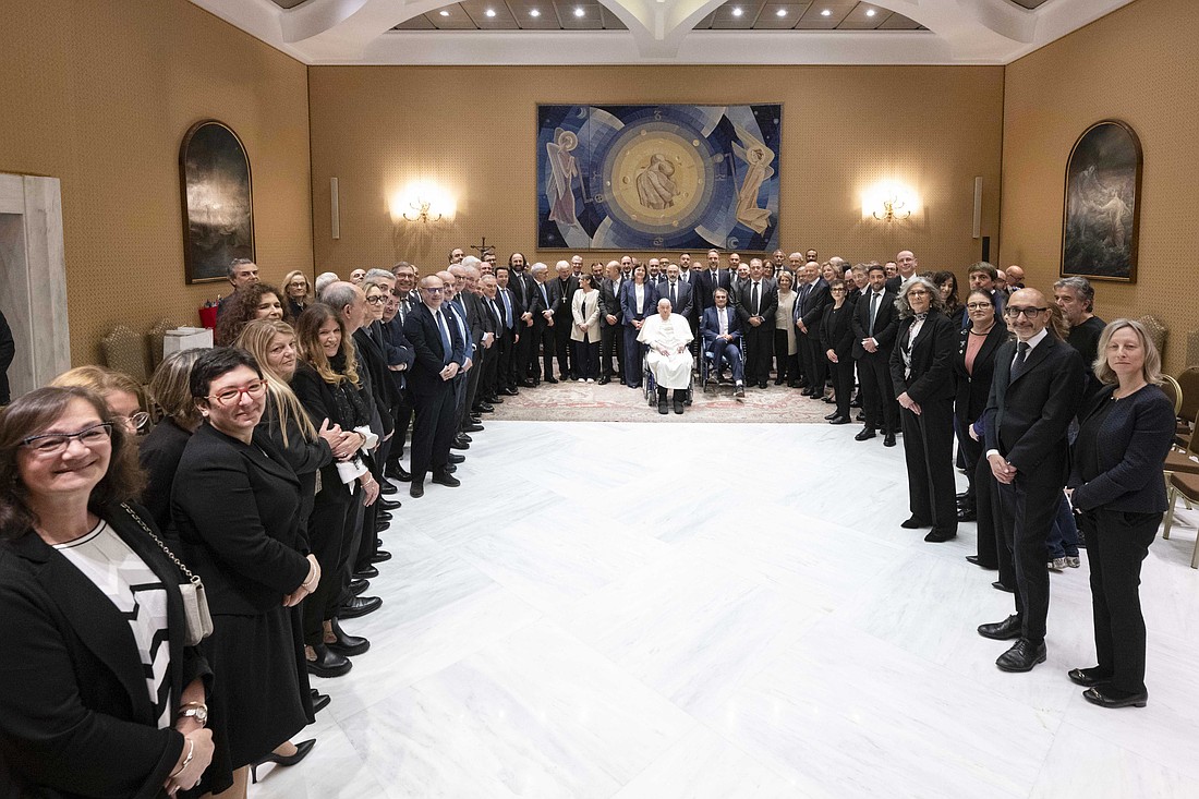 Pope Francis poses for a photo with the heath care workers and medical staff who cared for him during his hospitalization during a meeting at the Vatican April 16, 2025. (CNS photo/Justin McLellan)