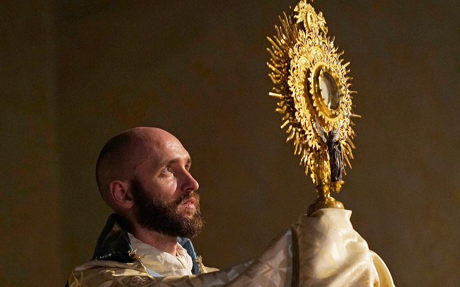 Father Kevin Cassidy of the Missionaries of the Most Holy Eucharist elevates the monstrance during Eucharistic adoration at Immaculate Conception Seminary in Huntington, N.Y., July 22, 2024, the feast of St. Mary Magdalene. The liturgy was part of an "Evening with Mary Magdalene" that also included Mass, confession and veneration of a relic of the saint. (OSV News photo/Gregory A. Shemitz)
