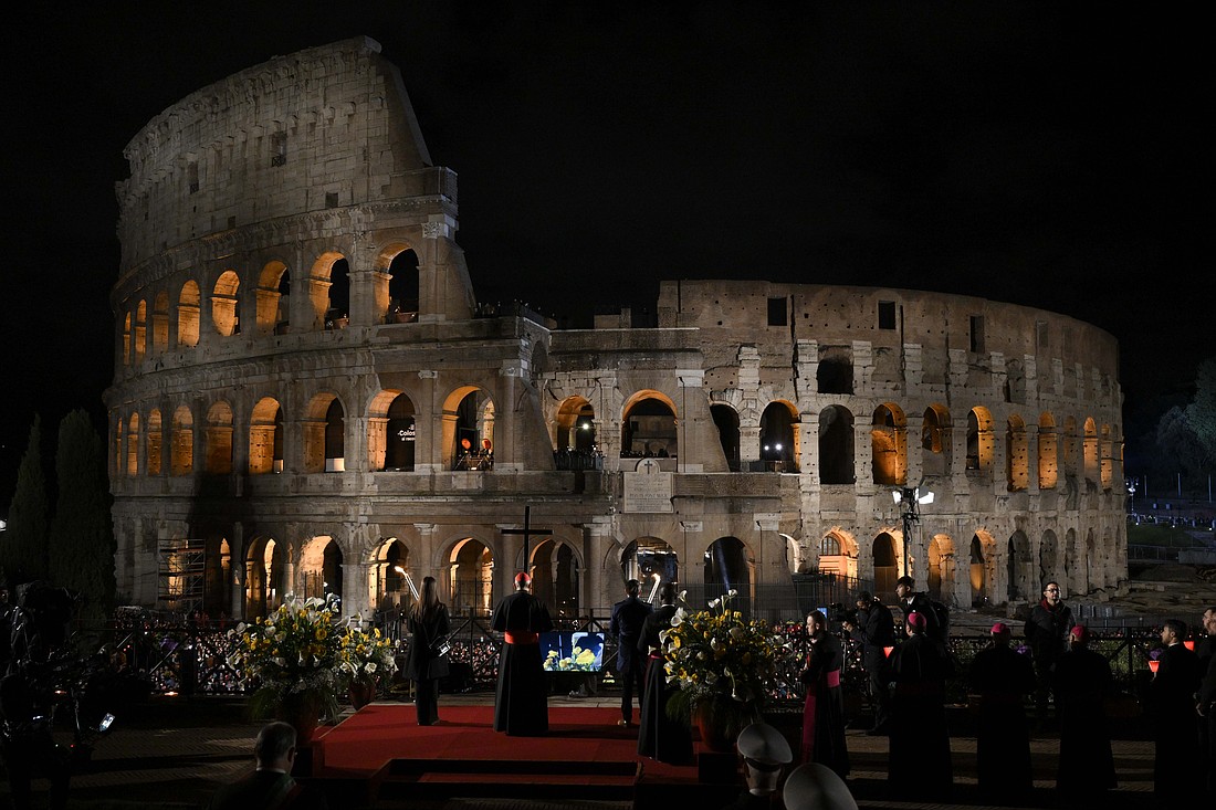 Cardinal Baldassare Reina, papal vicar of Rome, leads the Way of the Cross procession during the Good Friday service in Rome April 18, 2025. (CNS photo/Vatican Media)