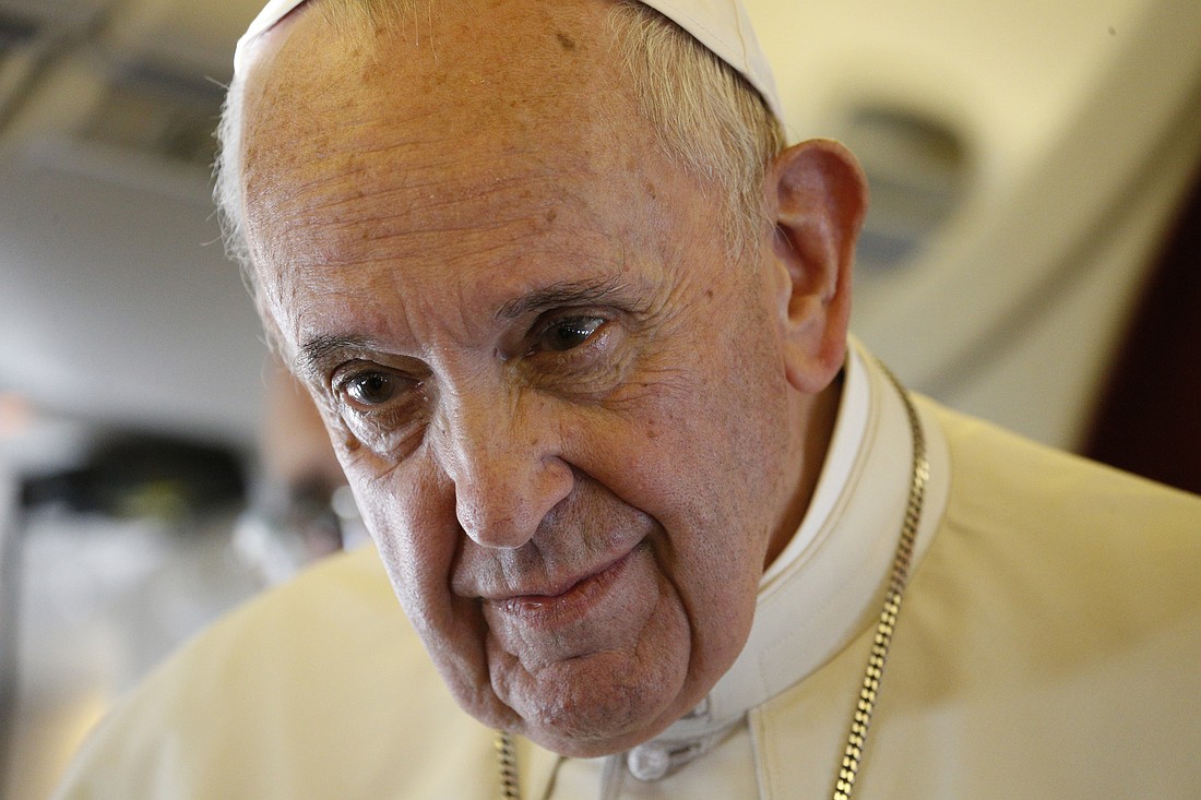 Pope Francis listens to a question from a journalist aboard his flight from Rabat, Morocco, to Rome March 31, 2019. (CNS photo/Paul Haring) See POPE-MOROCCO-PLANE March 31, 2019.