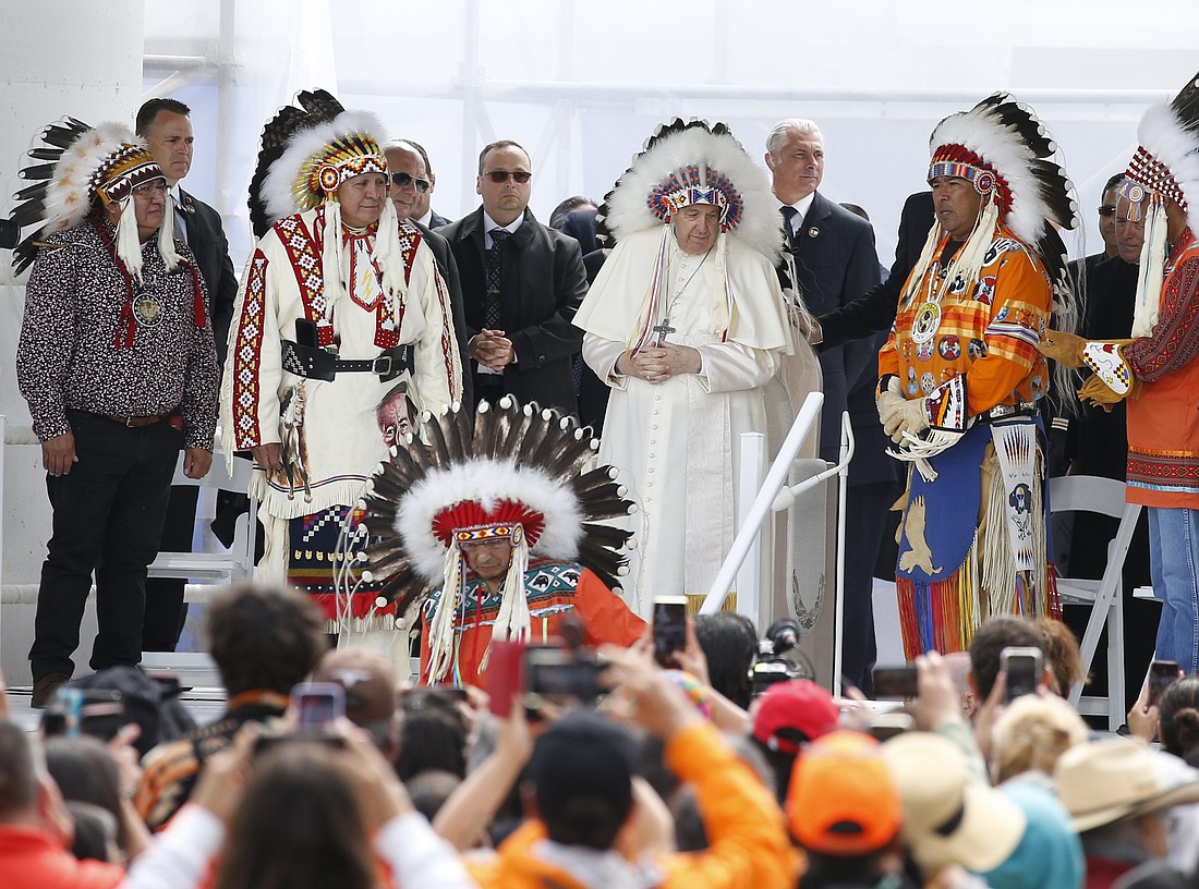 Pope Francis wears a traditional Indigenous headdress during a meeting with First Nations, Métis and Inuit communities at Maskwacis, Alberta, July 25, 2022. (CNS photo/Paul Haring)