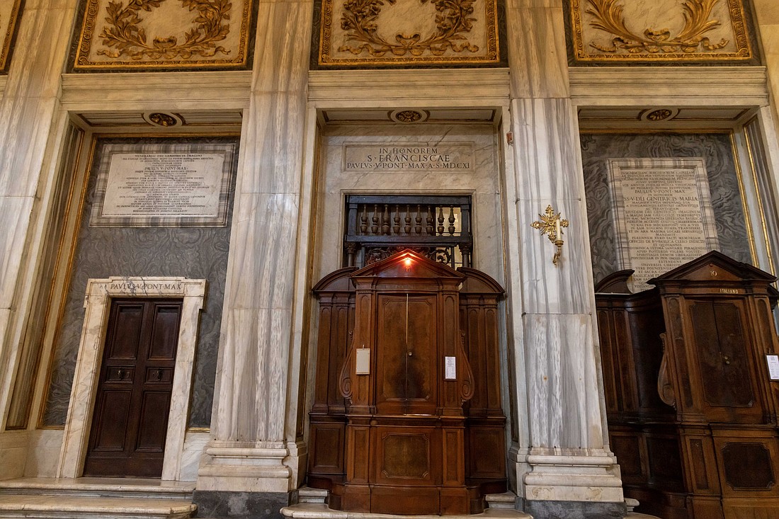 A doorway to the left of a confessional is seen in Rome's Basilica of St. Mary Major March 31, 2025. In his autobiography, released in January, Pope Francis said his tomb would be "in the room where they now keep the candelabra," a small storage closet between the statue of Mary, Queen of Peace, and the chapel featuring the Marian icon "Salus Populi Romani" ("health of the Roman people") where he prayed before and after each of his foreign trips. (CNS photo/Pablo Esparza)