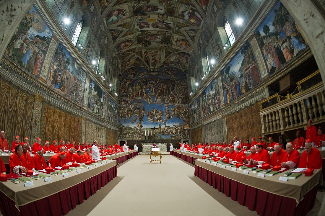 Cardinals from around the world pray in the Sistine Chapel at the Vatican March 12, 2013, before beginning the conclave to elect a successor to Pope Benedict XVI. The following day, on the fifth ballot, they elected Cardinal Jorge Mario Bergoglio of Buenos Aires, Argentina, who chose the name Francis. (CNS photo/Vatican Media)