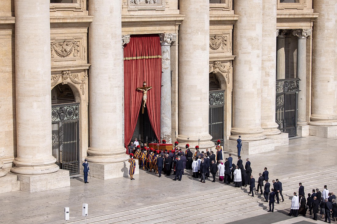 Pallbearers carry the body of Pope Francis in his casket through St. Peter's Square on their way into St. Peter's Basilica at the Vatican April 23, 2025, as the pope's mortal remains are prepared for public viewing and prayer. (CNS photo/Pablo Esparza)