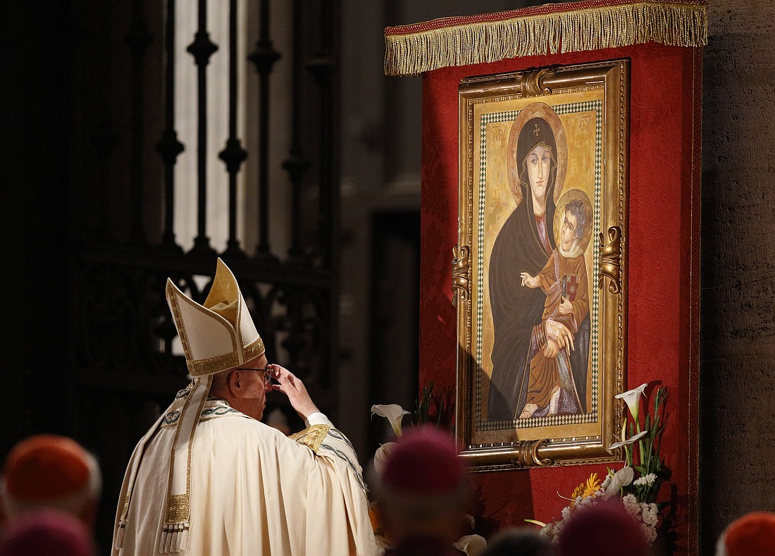 Pope Francis venerates a Marian image outside the Basilica of St. Mary Major in Rome in this May 26, 2016, file photo. Pope Francis died April 21, 2025, at age 88. He will be entombed at the basilica. (CNS photo/Paul Haring)