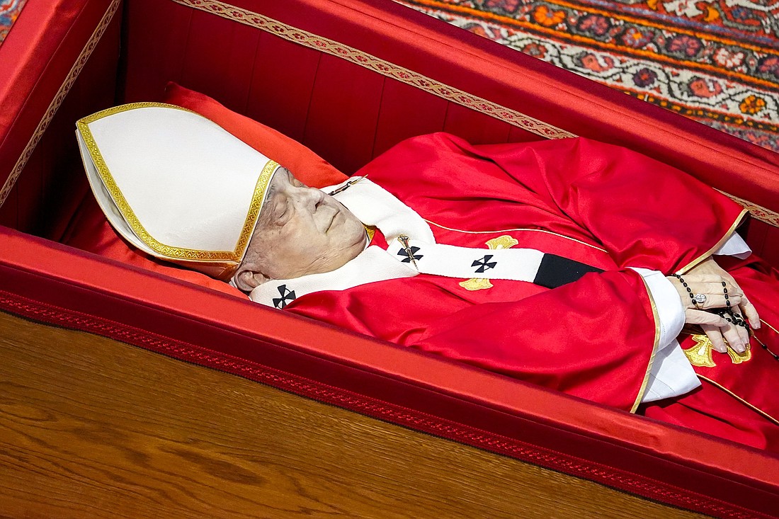The body of Pope Francis lies in an open casket in front of the Altar of the Confession in St. Peter’s Basilica at the Vatican April 23, 2025. The casket will stay open for three days of public viewing and prayer ahead of his funeral Mass April 26. (CNS photo/Lola Gomez)