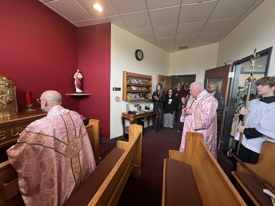 Parishioners enter the newly blessed chapel. Elizabeth Zimak photos.