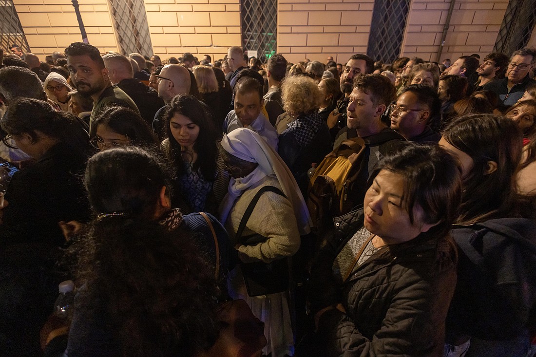 People stand in line outside the Vatican to pay their respects to Pope Francis, lying in state in St. Peter's Basilica at the Vatican April 23, 2025. Public viewing was to continue until April 25, the night before the late pope's funeral. (CNS photo/Pablo Esparza)