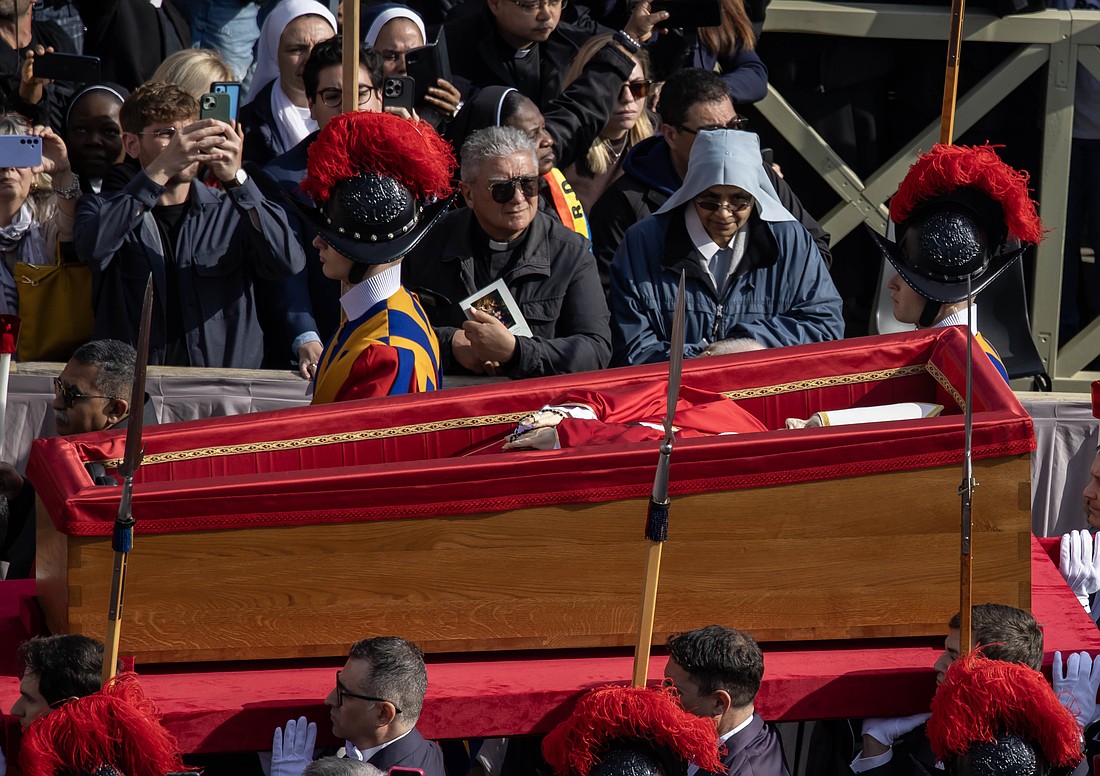 Pallbearers carry the body of Pope Francis in his casket through St. Peter's Square on their way into St. Peter's Basilica at the Vatican April 23, 2025, as the pope's mortal remains are prepared for public viewing and prayer. (CNS photo/Pablo Esparza)