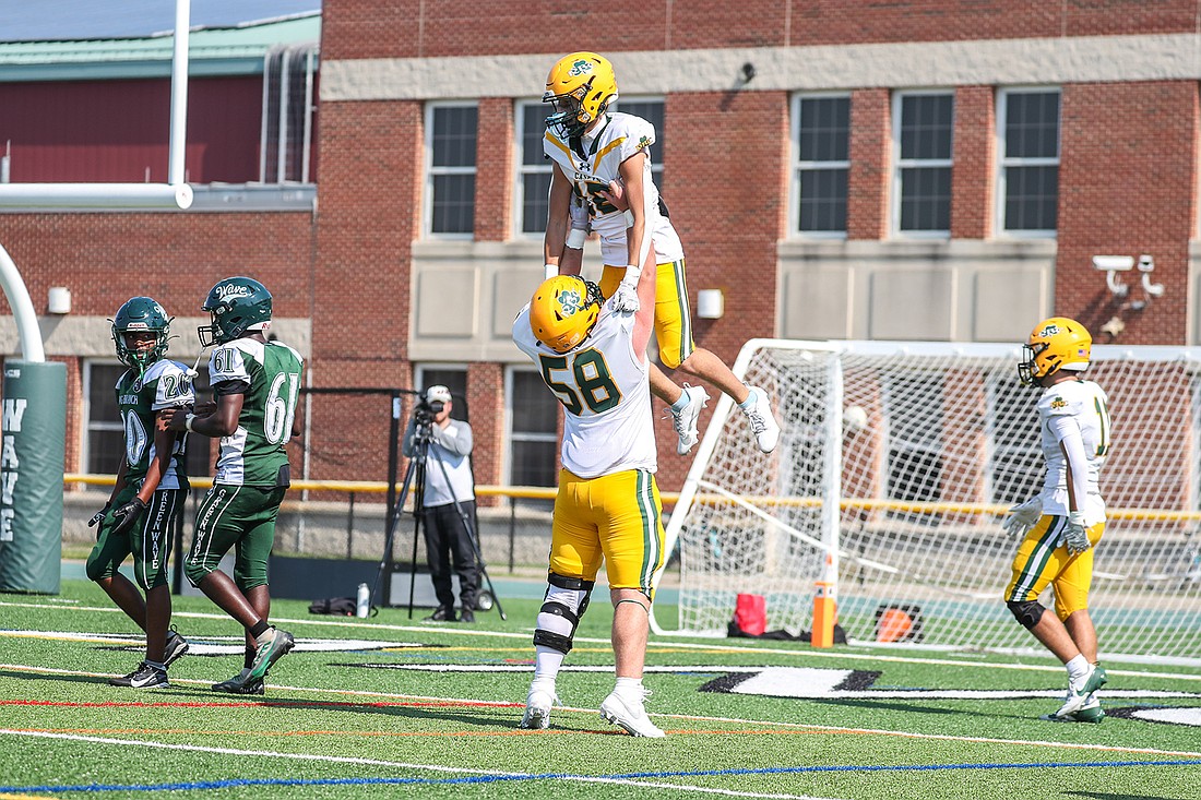 Frank Sinatra, center for the Red Bank Catholic Caseys, lifts a teammate overhead in a moment of celebration. Photo by Jennifer Harms/jharmsphotography.com