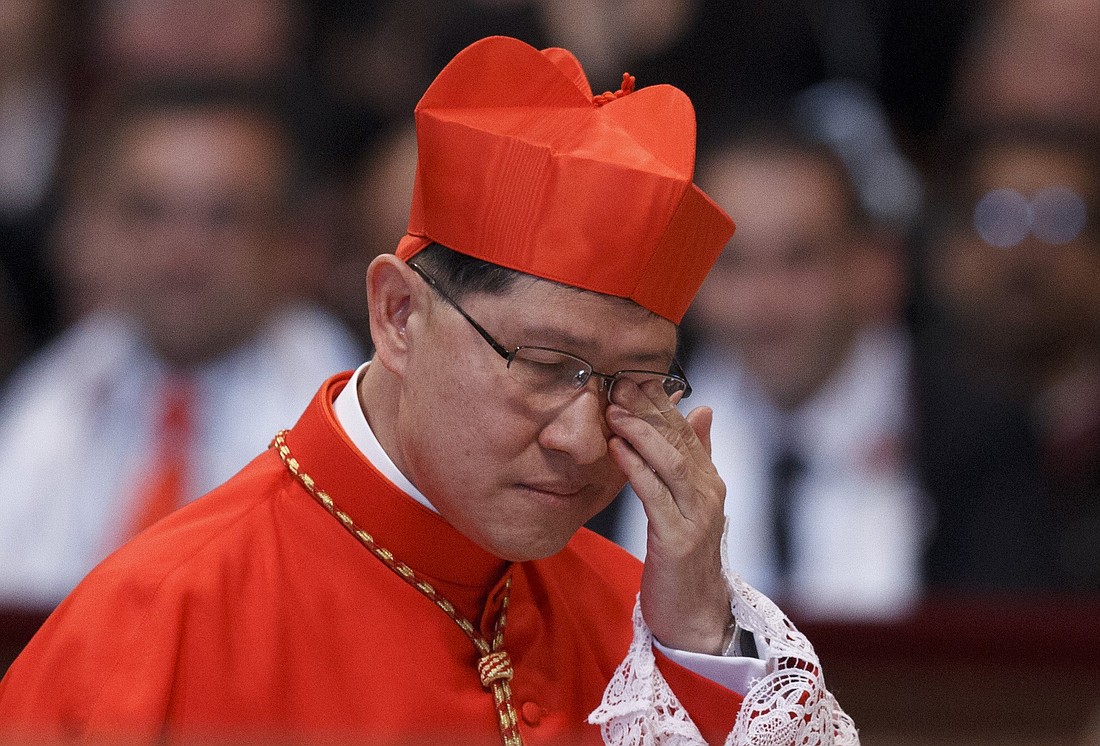 New Cardinal Luis Tagle of Manila wipes away tears after being made a cardinal by Pope Benedict XVI during a consistory in St. Peter's Basilica at the Vatican Nov. 24. The pope created six new cardinals from four different continents, representing the Latin rite as well as two Eastern Catholic Churches. (CNS photo/Paul Haring) (Nov. 26, 2012) See CARDINALS-CONSISTORY Nov. 24, 2012.