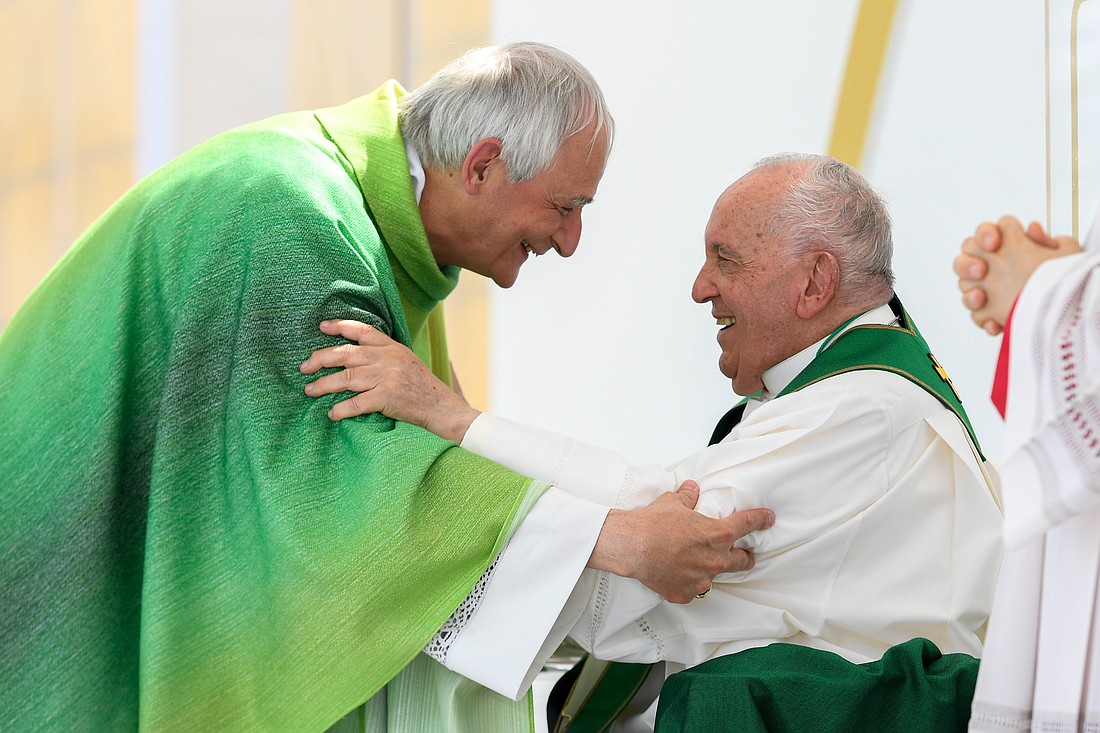 Pope Francis greets Italian Cardinal Matteo Zuppi of Bologna, president of the Italian bishops' conference, as he celebrates Mass in Trieste, Italy, July 7, 2024. (CNS photo/Vatican Media)