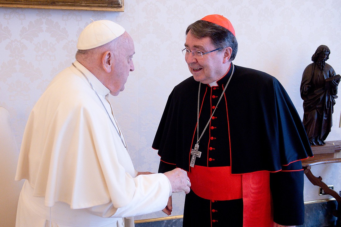 Pope Francis greets Cardinal Christophe Pierre, the Vatican nuncio to the United States, in the library of the Apostolic Palace at the Vatican April 22, 2024. In an interview days after the death of the pope, Cardinal Pierre said now was "a moment for the Holy Spirit." (CNS photo/Vatican Media)