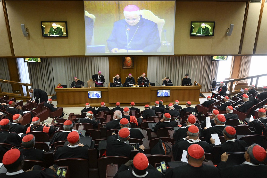 Benedictine Abbot Donato Ogliari, abbot of St. Paul Outside the Walls in Rome, center, offered a spiritual meditation April 29, 2025, in the Vatican synod hall to cardinals attending the general congregation before the conclave begins. The abbot is seated between Cardinal Giovanni Battista Re, dean of the College of Cardinals, and Cardinal Kevin J. Farrell, chamberlain of the Holy Roman Church. (CNS photo/Vatican Media)
