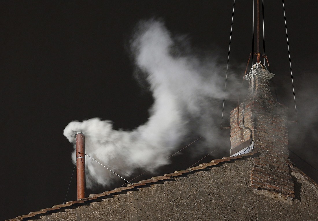 White smoke billows from the chimney of the Sistine Chapel March 13, 2013, at the Vatican. Argentine Cardinal Jorge Mario Bergoglio, now Pope Francis, was elected the 266th Roman Catholic pontiff. Details surrounding the pope's election and other events can be found in the Vatican's recently published annual report of activities in 2013. (CNS photo/Paul Haring) See VATICAN LETTER July 23, 2015.