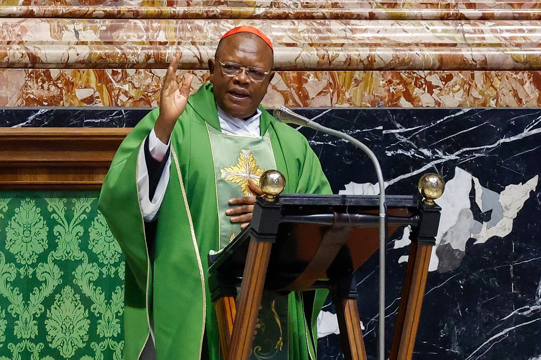 Cardinal Fridolin Ambongo of Kinshasa, Congo, president of the Symposium of Episcopal Conferences of Africa and Madagascar, gives his blessing at the end of a Mass in St. Peter's Basilica for participants in the assembly of the Synod of Bishops at the Vatican Oct. 13, 2023. (CNS photo/Lola Gomez)