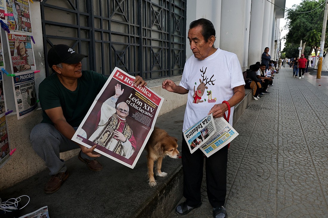 People hold newspapers in Chiclayo, Peru, May 9, 2025, reporting on the election of Pope Leo XIV, who is a dual U.S.-Peruvian citizen. Formerly Cardinal Robert F. Prevost, the prelate was elected pope May 8 at the Vatican, becoming the first American pope in history. As an Augustinian priest, then-Father Prevost spent many years as a missionary in Peru. (OSV News photo/Sebastian Castaneda, Reuters)