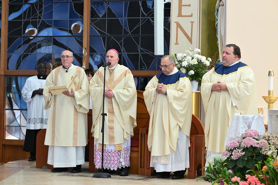 Bishop O'Connell celebrates the a Mass of Thanksgiving for the election of Pope Leo XIV in St. Gregory the Great Church, Hamilton Square, May 10. With the Bishop are Deacon Joe Latini, left; Msgr. Thomas N. Gervasio, diocesan vicar general, and Father Michael Hall, parish pastor. Mike Ehrmann photo