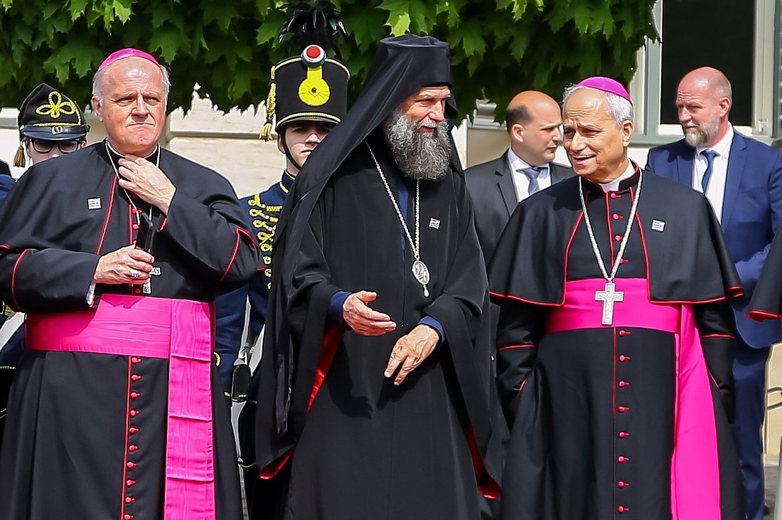 Metropolitan Archbishop Fülöp Kocsis of Hajdudorog, Hungary, center, speaks with then-Archbishop Robert Francis Prevost, prefect of the Dicastery for Bishops, as they await the arrival of Pope Francis at the Buda Castle in Budapest April 28, 2023, during his apostolic visit to Hungary. Archbishop Michael Wallace Banach, apostolic nuncio to Hungary, stands to the left. Archbishop Prevost was named a cardinal in September 2023 and was elected pope May 8, 2025. Now Pope Leo XIV, he is the first American pope in history. (OSV News photo/Attila Lambert, courtesy of Magyar Kurir)