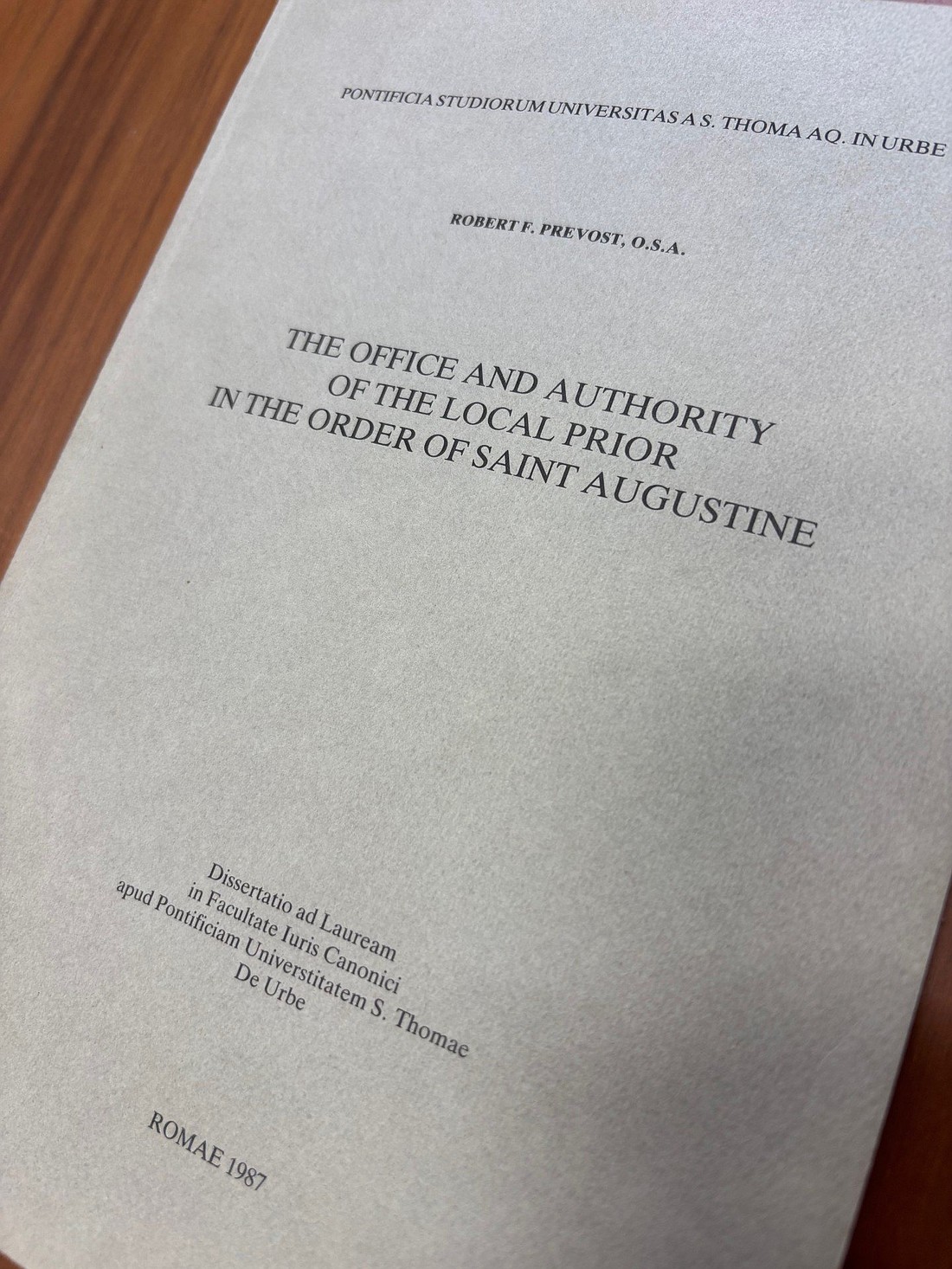 The doctoral dissertation of the future Pope Leo XIV, finalized in 1985 and published two years later, is seen May 12, 2025. The thesis bears the title "The office and authority of the local prior in the Order of Saint Augustine." (OSV News photo/Paulina Guzik)