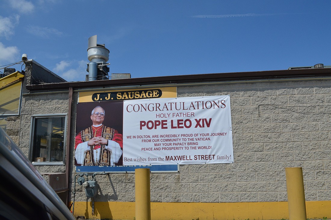 A a tribute sign to Pope Leo XIV, formally Cardinal Robert F. Prevost, is displayed outside a hot dog stand in the Dolton suburb of Chicago, May 9, 2025, where Pope Leo grew up as Robert F. Prevost. The manager said the pope's two brothers used to stop by there for hotdogs - with no ketchup, a signature Chicago hotdog. (OSV News photo/Simone Orendain)
