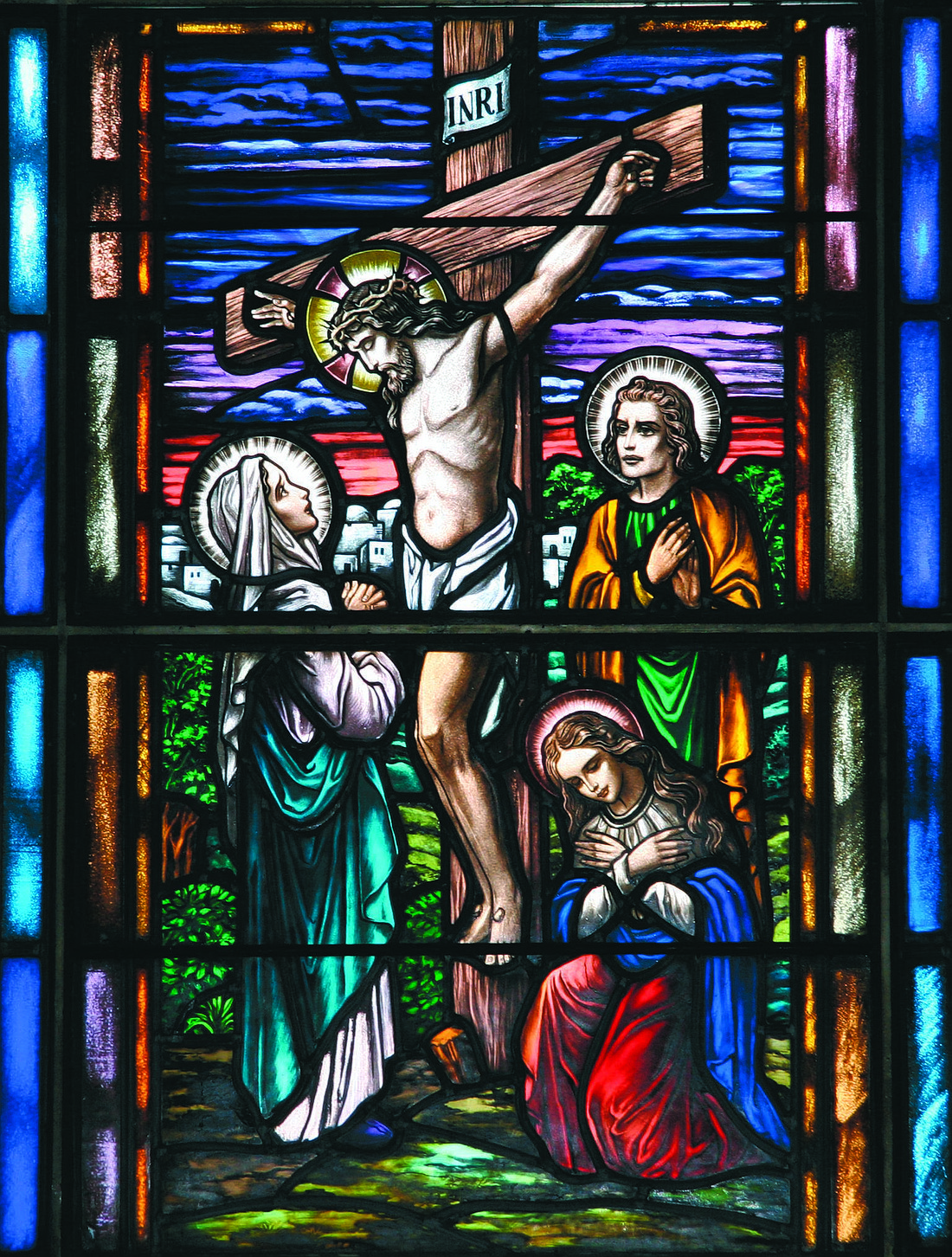 This stained glass image of the Crucifixion in Incarnation Church, Ewing, reflects the Gospel message for May 18, 2025, in which Jesus set the example on what it means for one to lay down his or her life for the sake of others. File photo