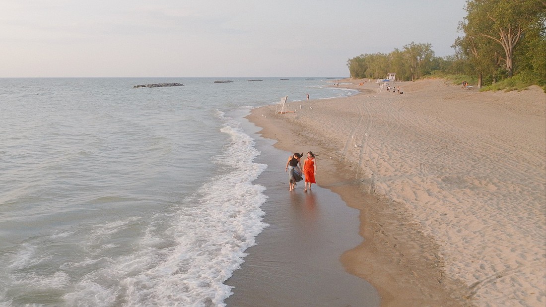 Kate Stapleton walks along the shore with her biological daughter, Brigid, in the documentary about their adoption story, "The Inner Sea." (OSV News photo/courtesy Kate Stapleton)
