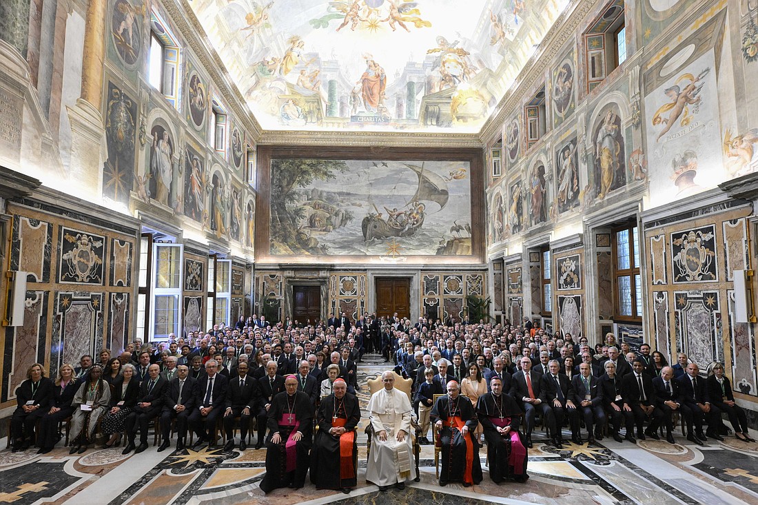 Pope Leo XIV poses for a photo with members of the Centesimus Annus Foundation in the Clementine Hall of the Apostolic Palace at the Vatican May 17, 2025. The pope is seated between French Cardinal Jean-Marc Aveline of Marseille, left, and Cardinal Silvano Tomasi, a retired Vatican diplomat. (CNS photo/Vatican Media)