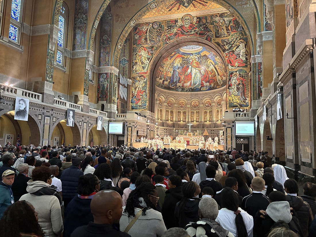 Pilgrims participate in a prayer vigil May 16, 2025, before the centenary of canonization of St. Thérèse of Lisieux in the sanctuary named for her in northern France's Normandy region. (OSV News photo/Olivier Valentine)