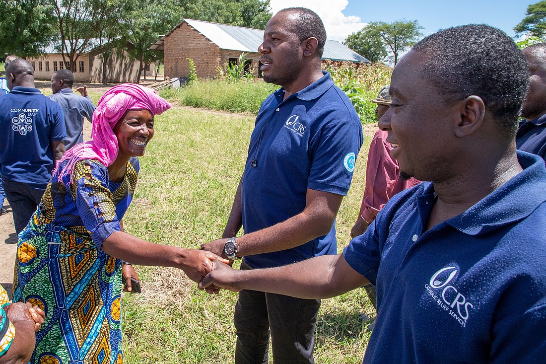 A village woman greets a Catholic Relief Services worker in Ipwizi, Tanzania, as CRS celebrates its 60th year of presence in Tanzania in March 2023. (OSV News photo/Carlos Barrio, Catholic Relief Services)