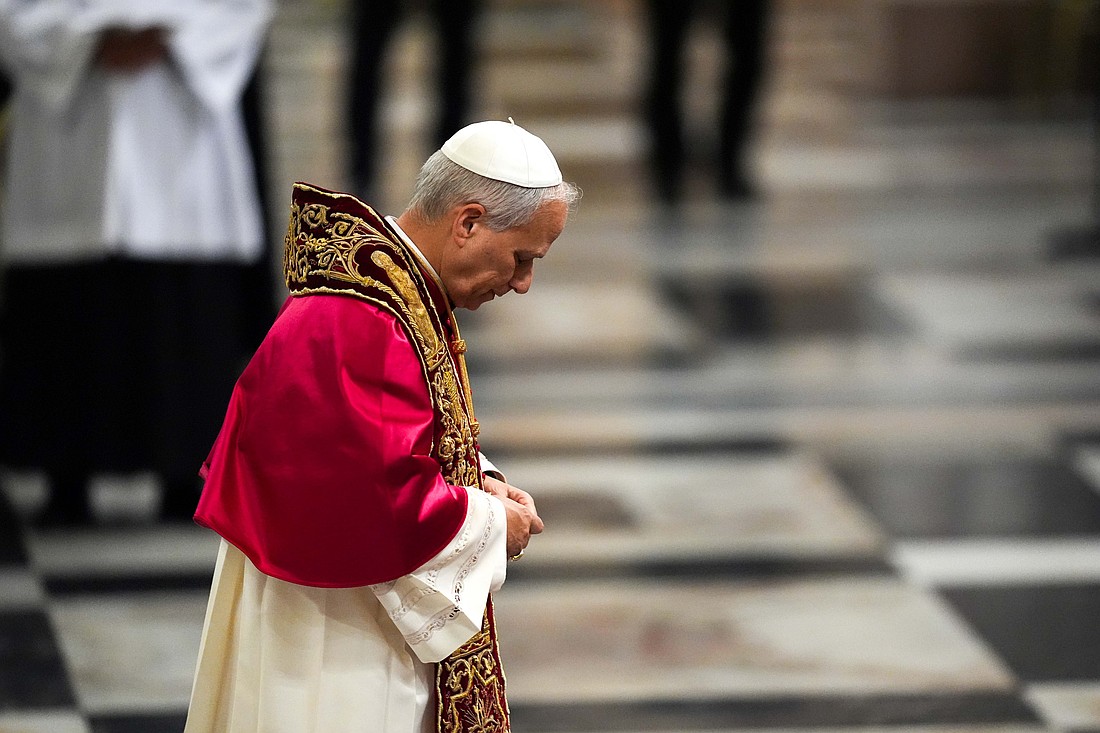 Pope Leo XIV prays in front of the tomb of St. Paul during a visit to the Basilica of St. Paul Outside the Walls in Rome May 20, 2025. (CNS photo/Lola Gomez)