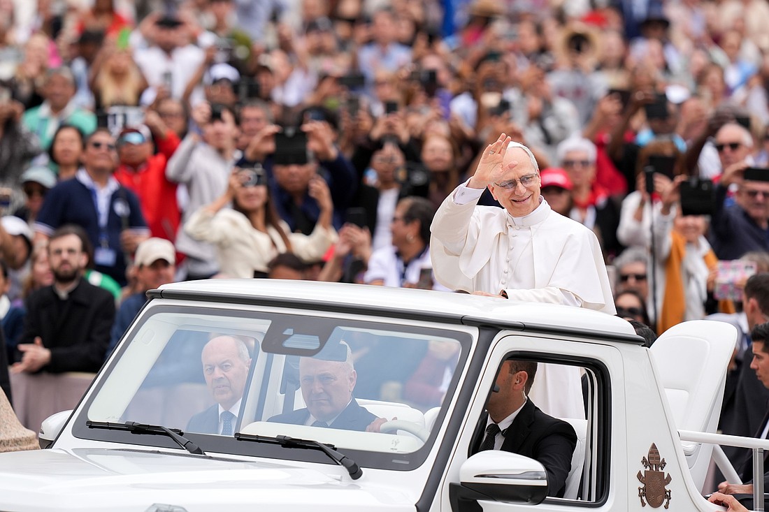 Pope Leo XIV rides through St. Peter's Square at the Vatican May 21, 2025, before holding his first weekly general audience. (CNS photo/Lola Gomez)