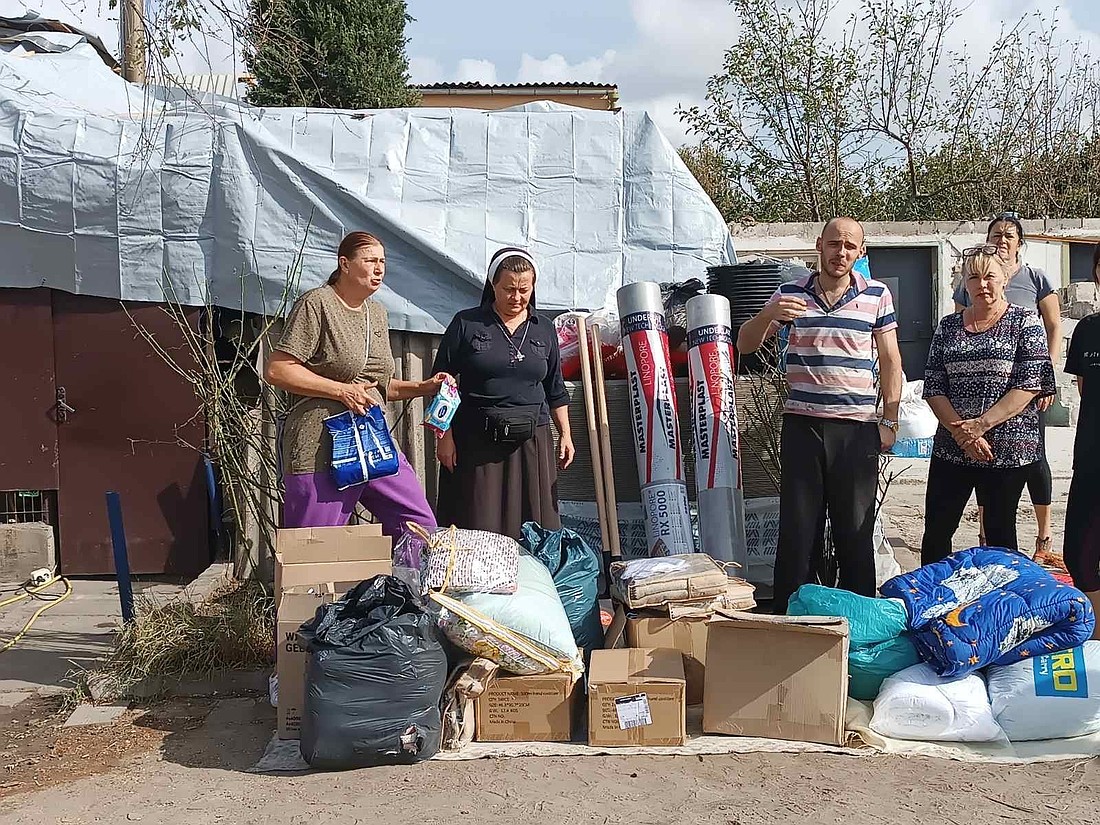 Basilian Sister Lucia Murashko is seen in this October 2024 image providing humanitarian aid to residents after a Russian attack on a village in Ukraine's Zaporizhzhia region. Sister Lucia and her fellow Basilians, based in the city of Zaporizhzhia, continue to support residents impacted by Russia's aggression, which began in 2014 and which accelerated with Russia's full-scale invasion in February 2022. (OSV News photo/Sister Lucia Murashko, Order of St. Basil the Great)