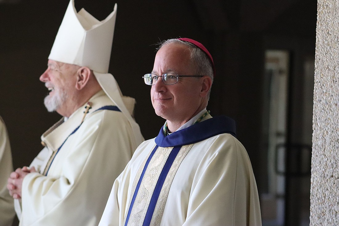 Prior to his episcopal ordination as auxiliary bishop of the U.S. Archdiocese for the Military Services May 9, 2025, Bishop-designate Gregg M. Caggianelli takes a moment before processing into St. Vincent Chapel on the campus of St. Vincent de Paul Regional Seminary in Boynton Beach, Fla., with clergy and bishops from across Florida and the nation. At left is Miami Archbishop Thomas G. Wenski. (OSV News photo/Jean Gonzalez, Florida Catholic)