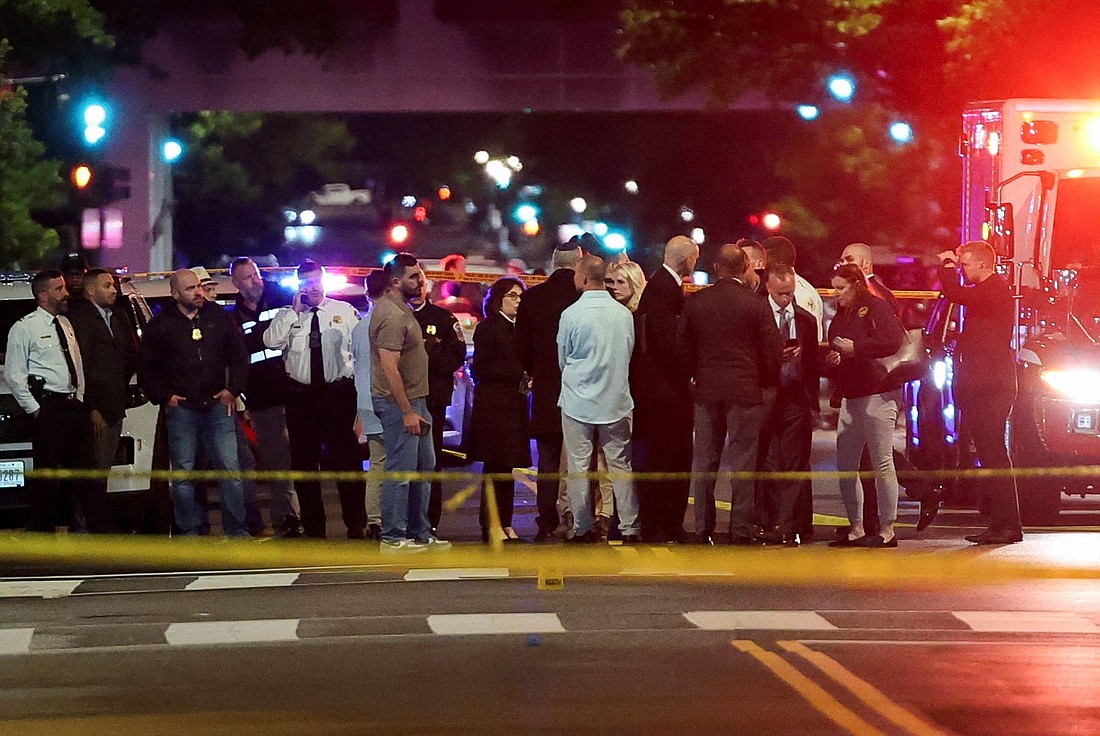 U.S. Attorney General Pam Bondi and Israeli Ambassador to the U.S. Yechiel Leiter speak to law enforcement officials as they visit the site where, according to the U.S. Department of Homeland Security, two Israeli Embassy staff were shot dead near the Capital Jewish Museum in Washington late May 21, 2025. The American Jewish Committee was hosting an evening event at the museum. (OSV News photo/Jonathan Ernst, Reuters)