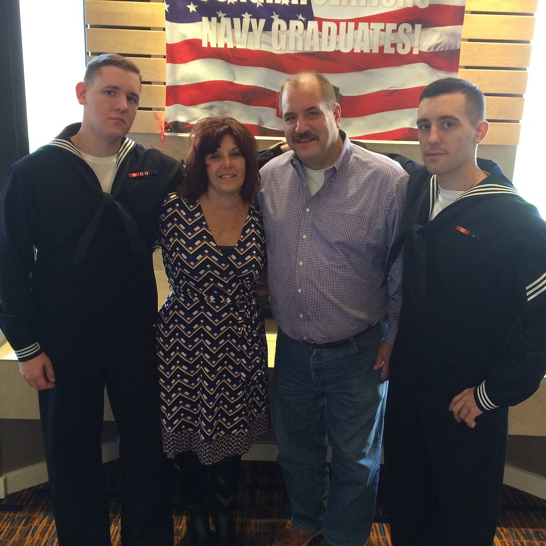 Alan Bridges, left, poses for a photo with his parents, Jack and Barbara Bridges, and brother John, right.