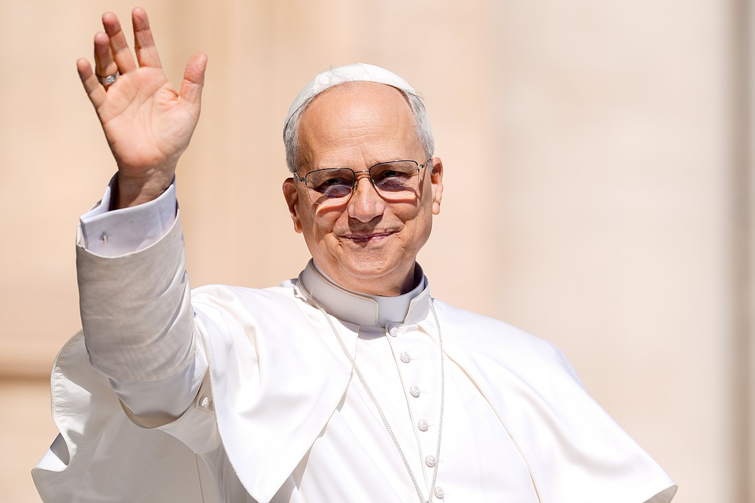 Pope Leo XIV greets visitors as he rides the popemobile around St. Peter’s Square at the Vatican May 28, 2025, ahead of his second weekly general audience. (CNS photo/Lola Gomez)