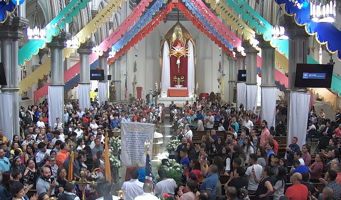 Faithful gather for Pentecost Mass in Immaculate Conception Church, worship site of Our Lady of the Angels parish, Trenton. Monitor file photo