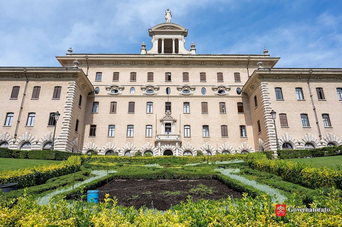Workers prepare to plant a botanical reproduction of Pope Leo XIV's coat of arms in mid-May 2025 at the Vatican. (CNS photo/courtesy of the office governing Vatican City State)