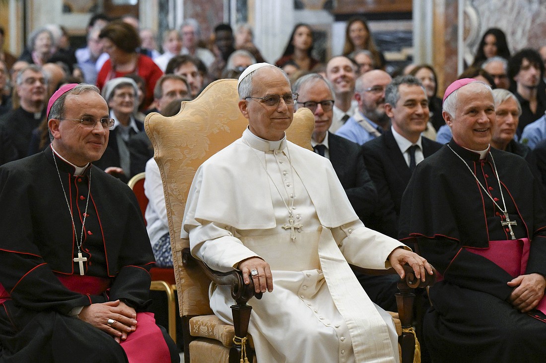 Pope Leo XIV poses for a photograph with members of grassroots groups and Catholic associations that work for peace and justice during an audience at the Vatican May 30, 2025. To the left of the pope is Bishop Domenico Pompili of Verona, Italy. (CNS photo/Vatican Media)