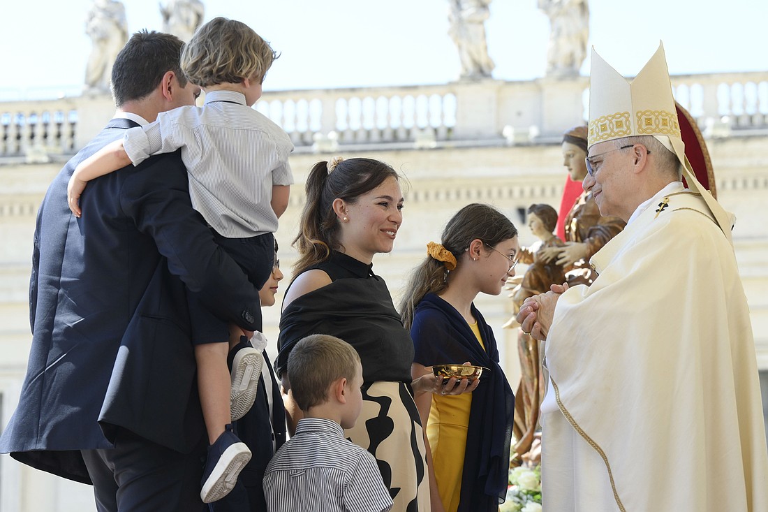 A family presents the offertory gifts to Pope Leo XIV during Mass marking the Jubilee of Families, Children, Grandparents and the Elderly in St. Peter’s Square at the Vatican June 1, 2025. (CNS photo/Vatican Media)