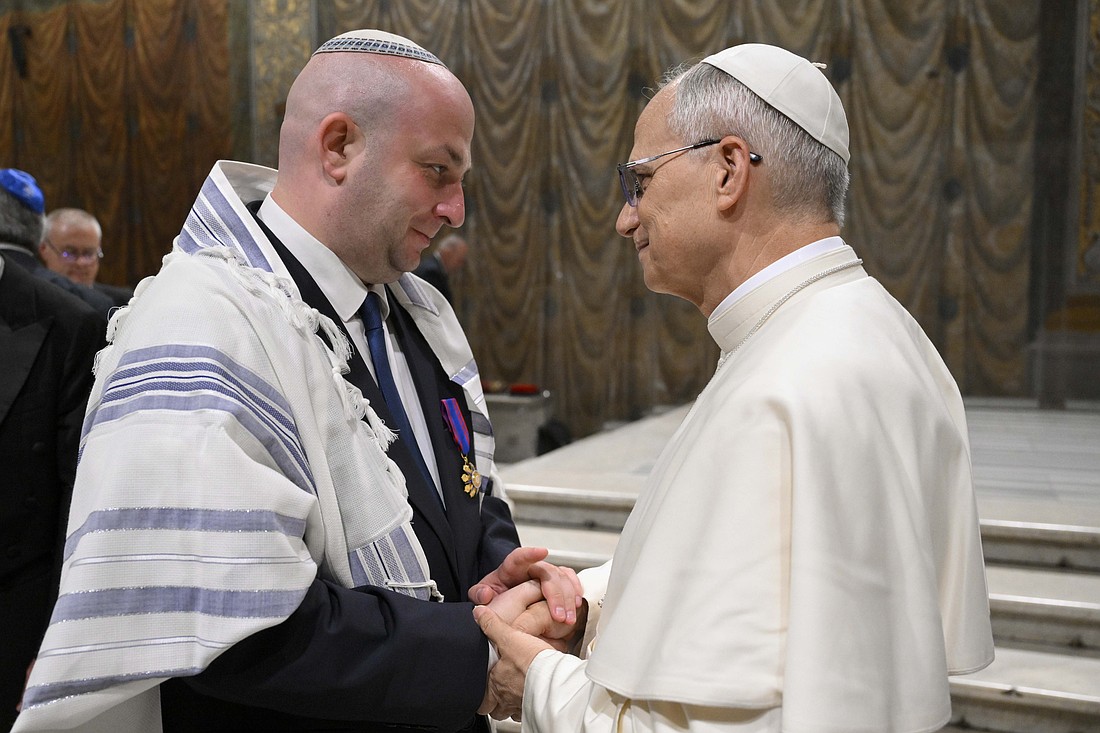 Pope Leo XIV greets Silviu Vexler, president of the Federation of Jewish Communities in Romania, during a ceremony honoring Blessed Iuliu Hossu in the Sistine Chapel at the Vatican June 2, 2025. (CNS photo/Vatican Media)