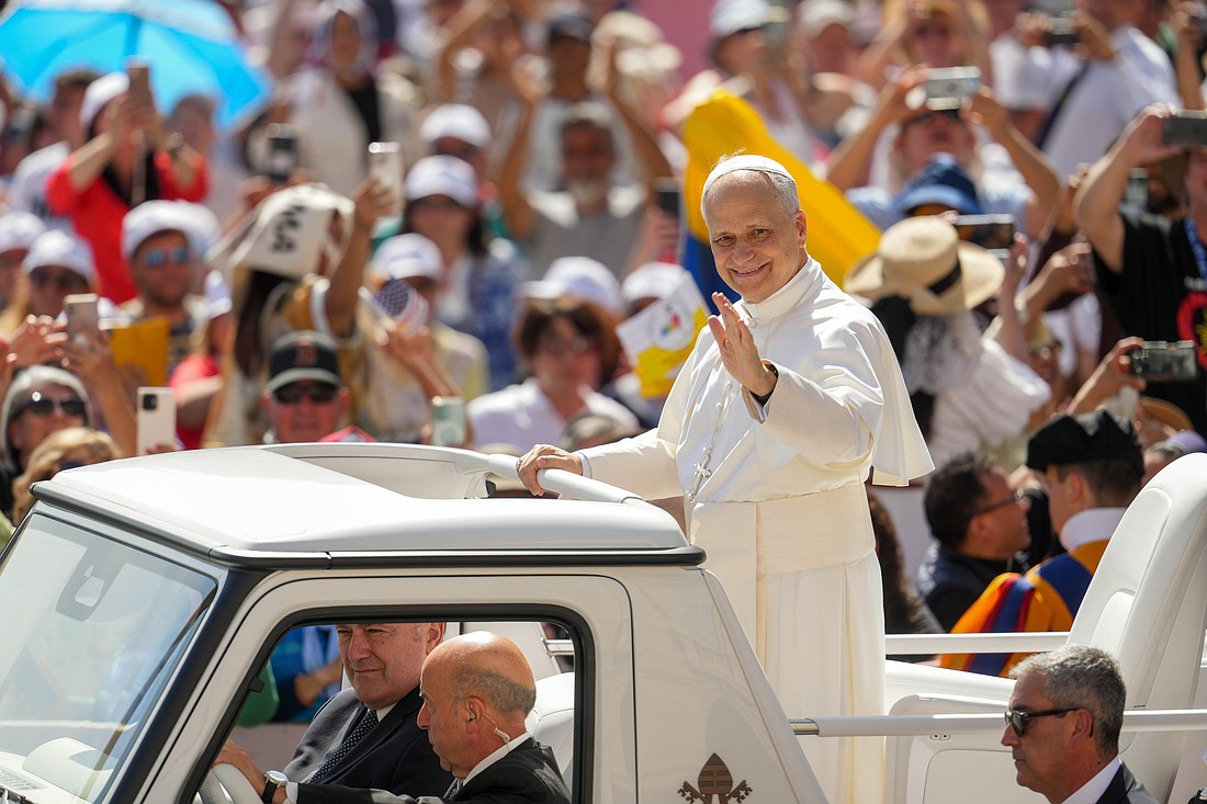 Pope Leo XIV greets visitors and pilgrims from the popemobile as he rides around St. Peter's Square at the Vatican before his weekly general audience June 4, 2025. (CNS photo/Lola Gomez)