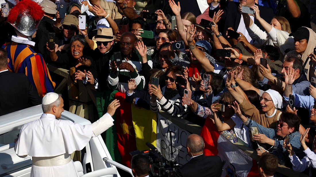 Pope Leo XIV, formerly Cardinal Robert Francis Prevost, greets the crowd as he arrives to celebrate his inauguration Mass at the Vatican May 18, 2025. He is the first American pope in history. (OSV News photo/Vincenzo Livieri, Reuters)