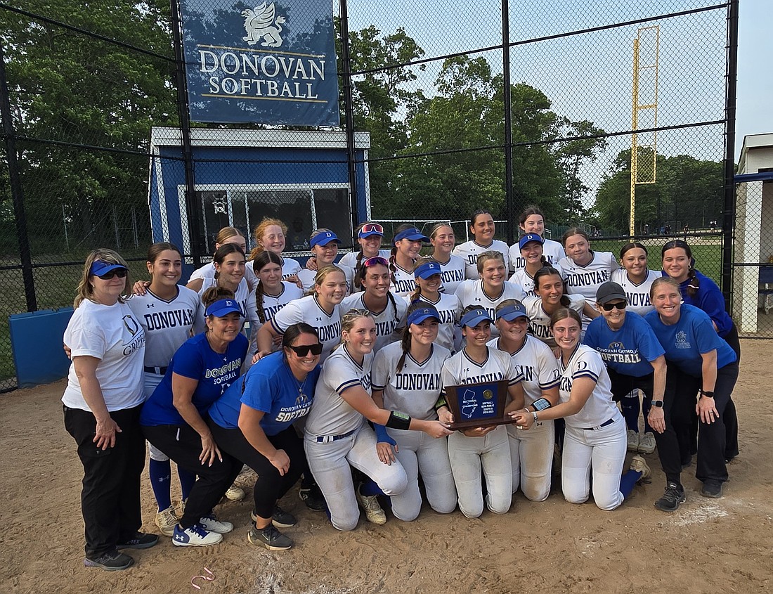 The Donovan Catholic softball team proudly displays it's championship plaque after winning the NJSIAA South Jersey Non Public A title with an 8-4 win over St. John Vianney June 5 in Toms River. It is the Griffins sixth sectional crown in nine seasons.  Photo by Rich Fisher