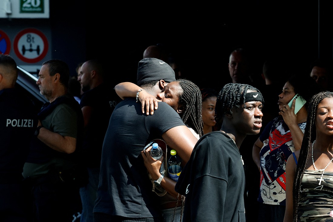 Family members reunite following a deadly shooting at Dreierschützengasse high school in Graz, Austria, June 10, 2025. A former student opened fire at the school in Austria's second-biggest city, killing at least nine people and wounding at least 12 others before taking his own life, authorities said. (OSV News photo/Borut Zivulovic, Reuters)