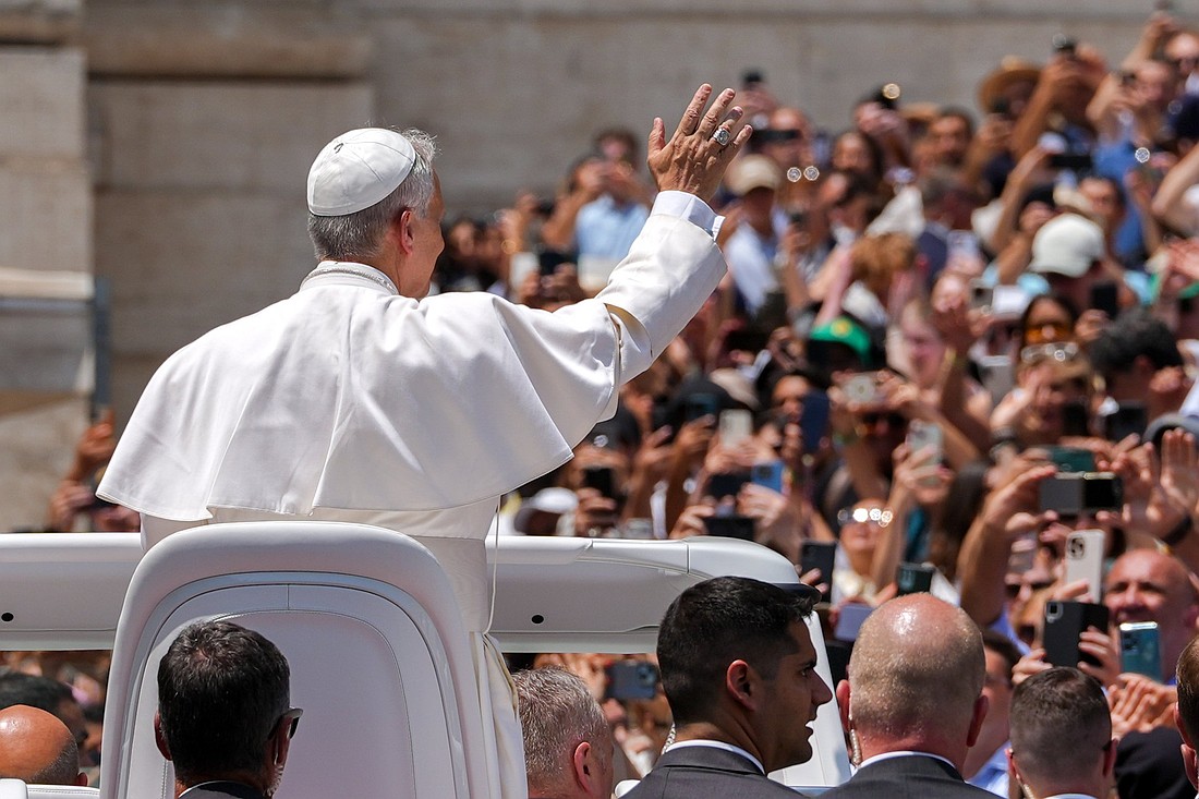 Pope Leo XIV greets visitors and pilgrims from the popemobile at the conclusion of his weekly general audience in St. Peter's Square at the Vatican June 11, 2025. (CNS photo/Lola Gomez)
